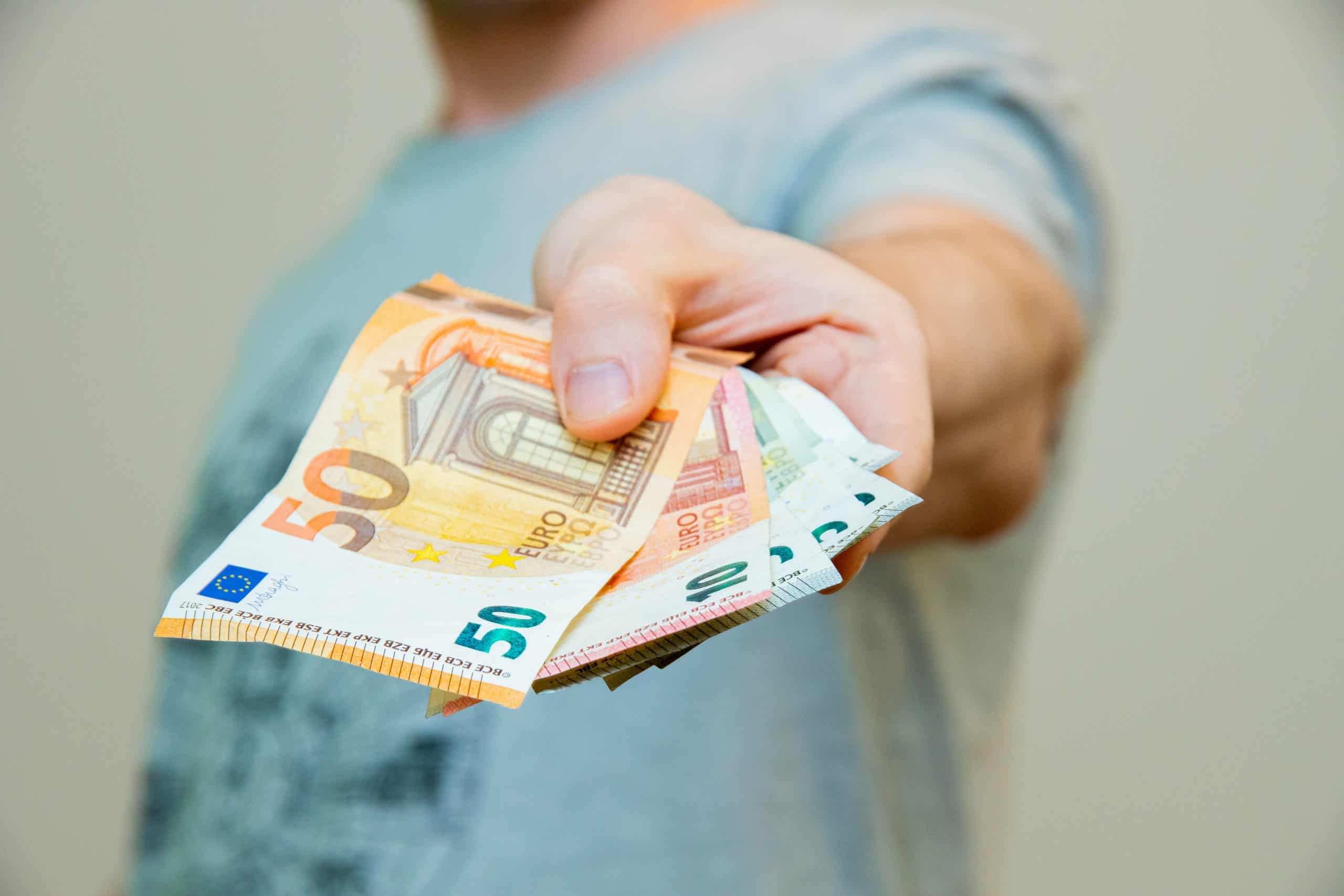 closeup of a hand holding fifty euros