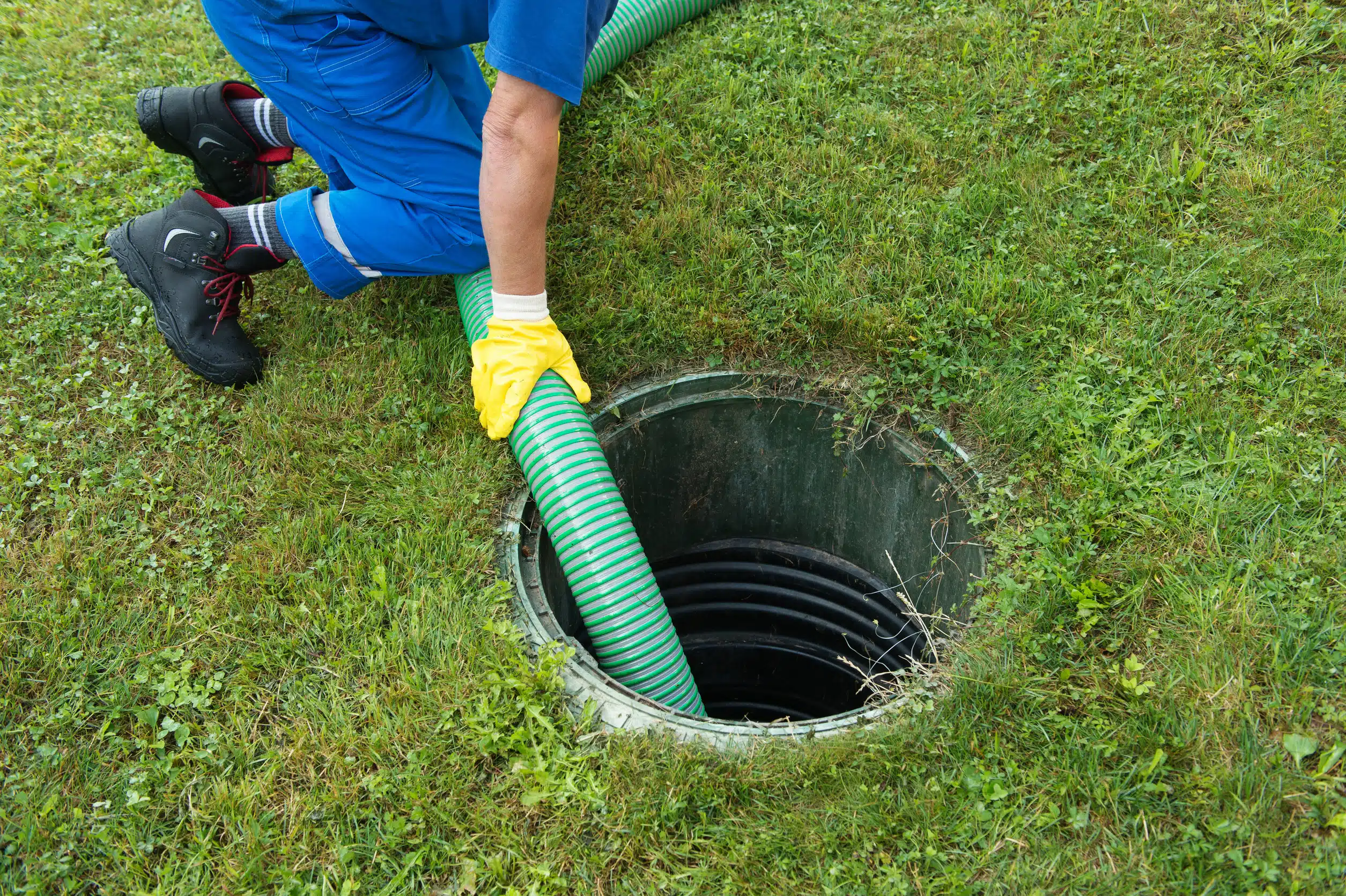 emptying household septic tank. cleaning and unblocking clogged drain.