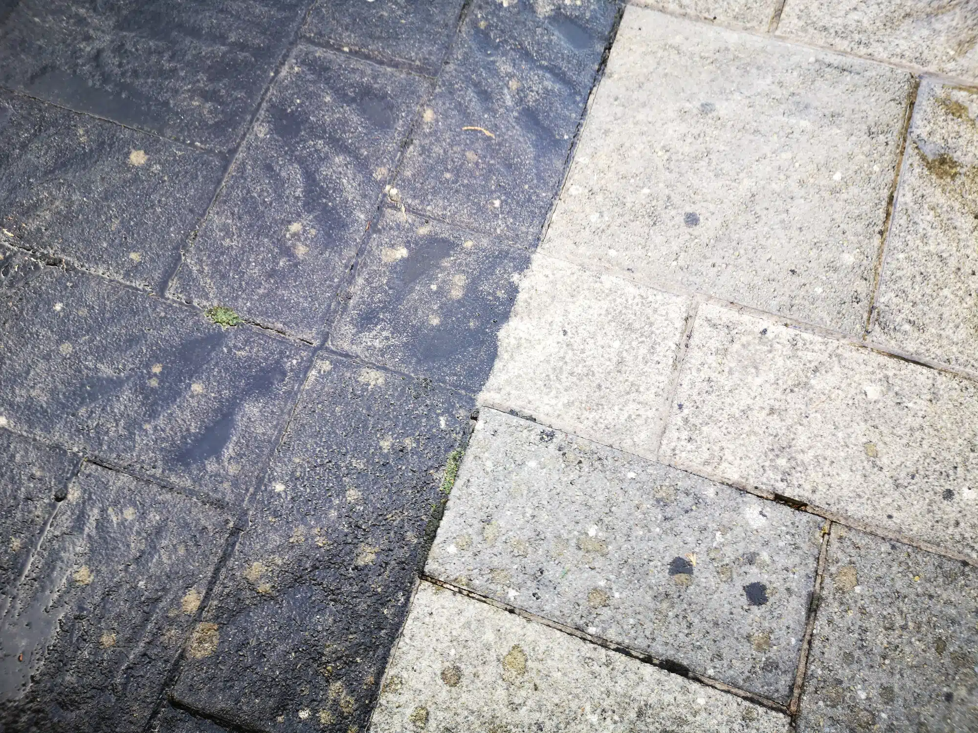 before and after jet washing a patio with an effective result.