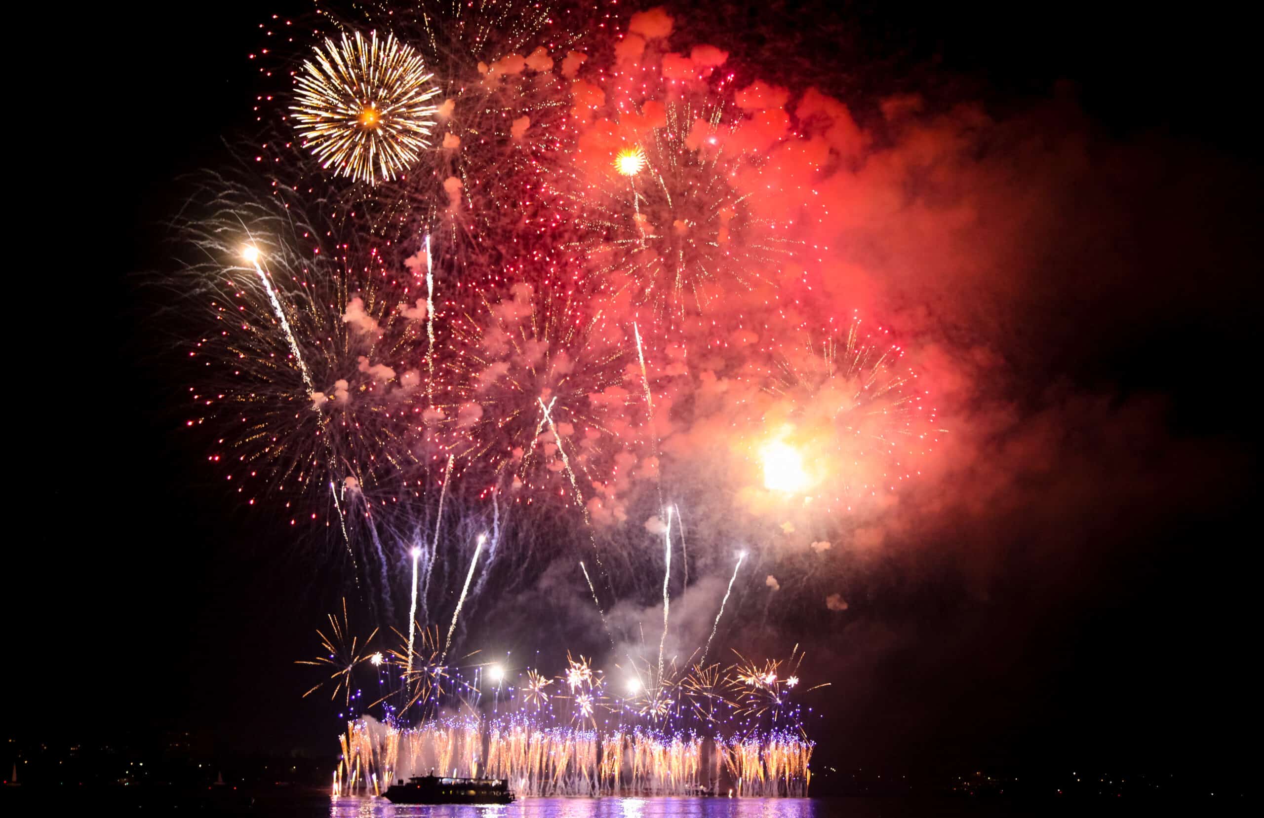multi colored fireworks on the river