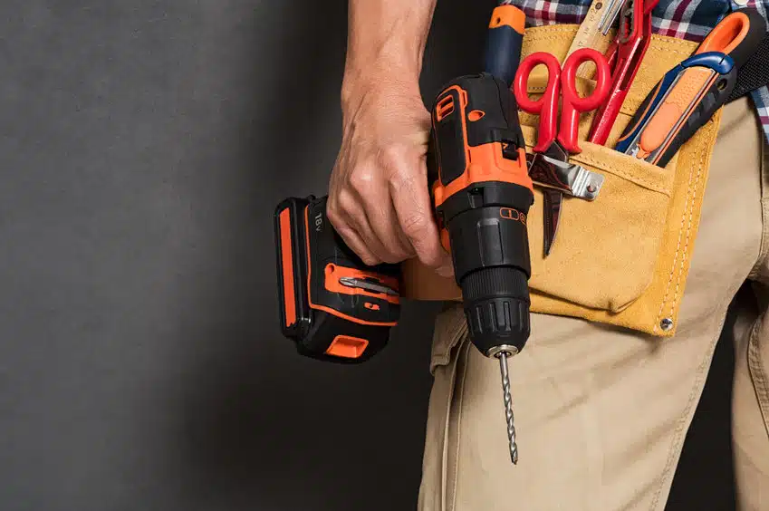 hand holding construction tools